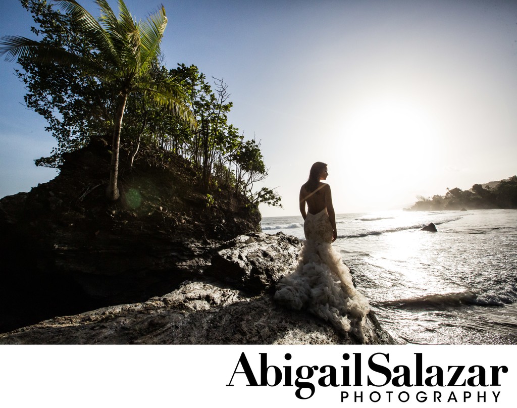Trash the dress: Bride on a cliff by the ocean