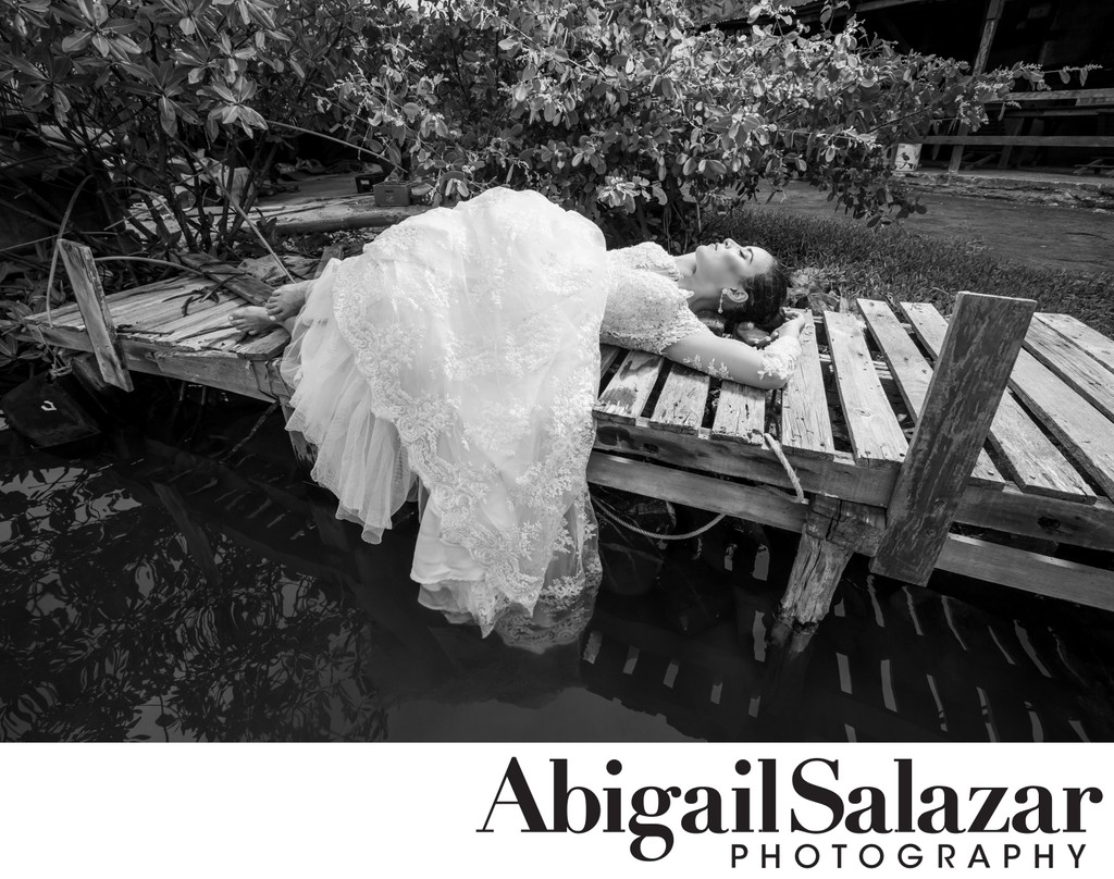 Bride's black and white portrait on a dock