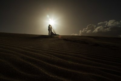 Bride & Groom portrait: Sand dunes trash the dress