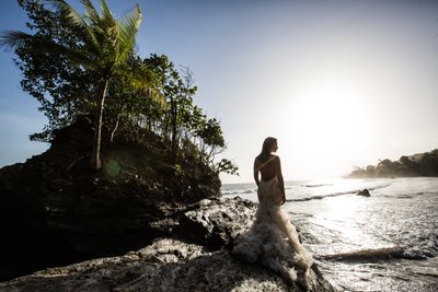 Trash the dress: Bride on a cliff by the ocean