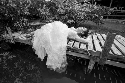Bride's black and white portrait on a dock