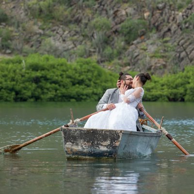 Unique wedding portrait: Bride & Groom kiss on a boat