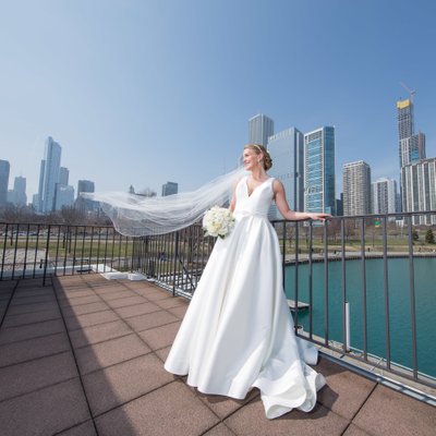 Bride's wedding veil flies: Chicago downtown skyline