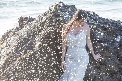 Trash the dress: Bride and ocean water splash