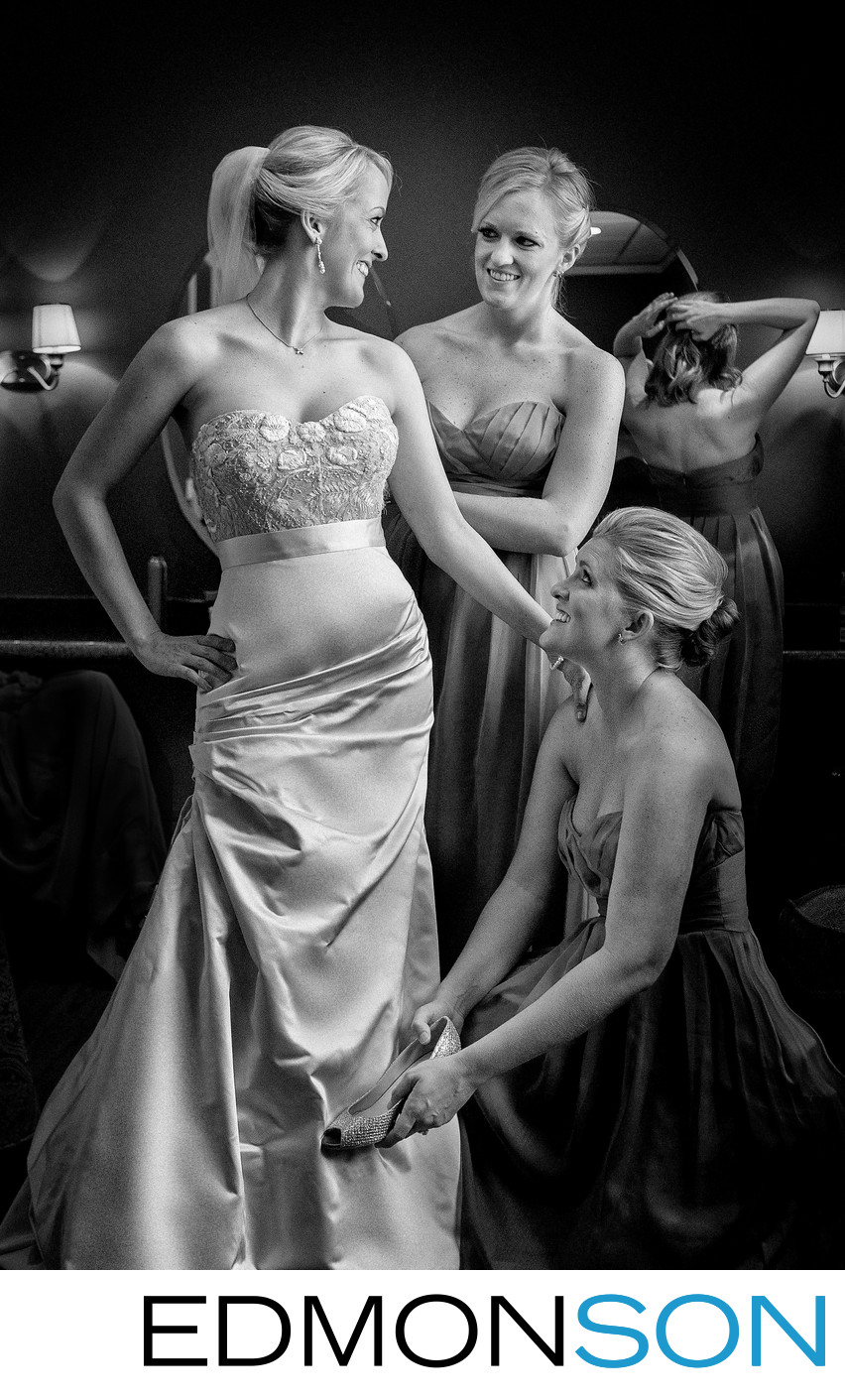 Bridesmaids Help Bride Finishing Touches On Wedding Day