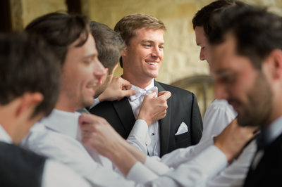 Candid Moment Shows The Energy Of Groomsmen Prepping