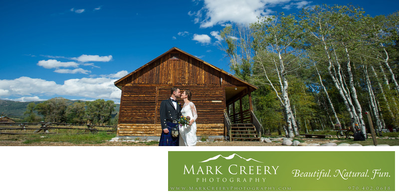 Couple By Cabin And Aspens In Steamboat Springs Wedding Colorado