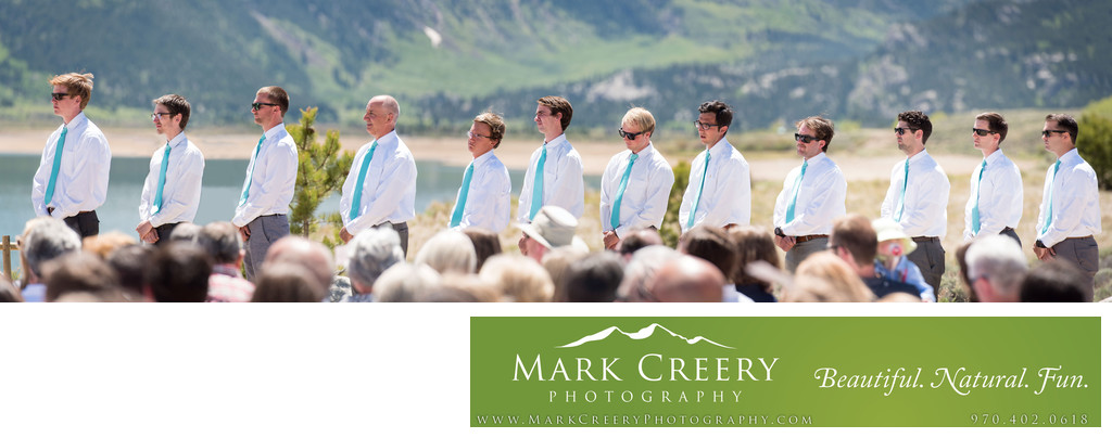 12 Groomsmen lined up during wedding ceremony in Colorado