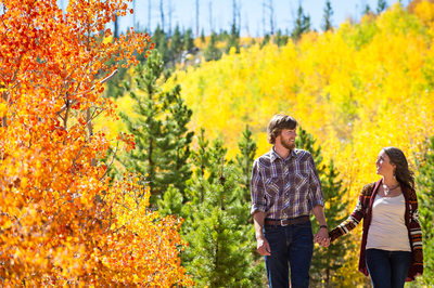 Outdoor engagement photos with bright Fall colors