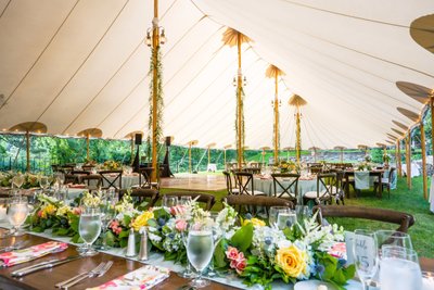 Sailcloth tent with farm tables Wedding Reception