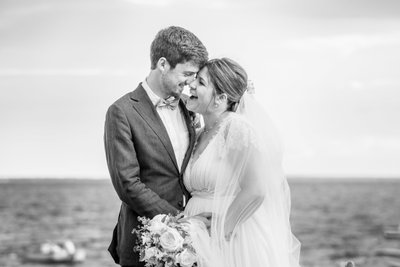 candid black white beach wedding photos