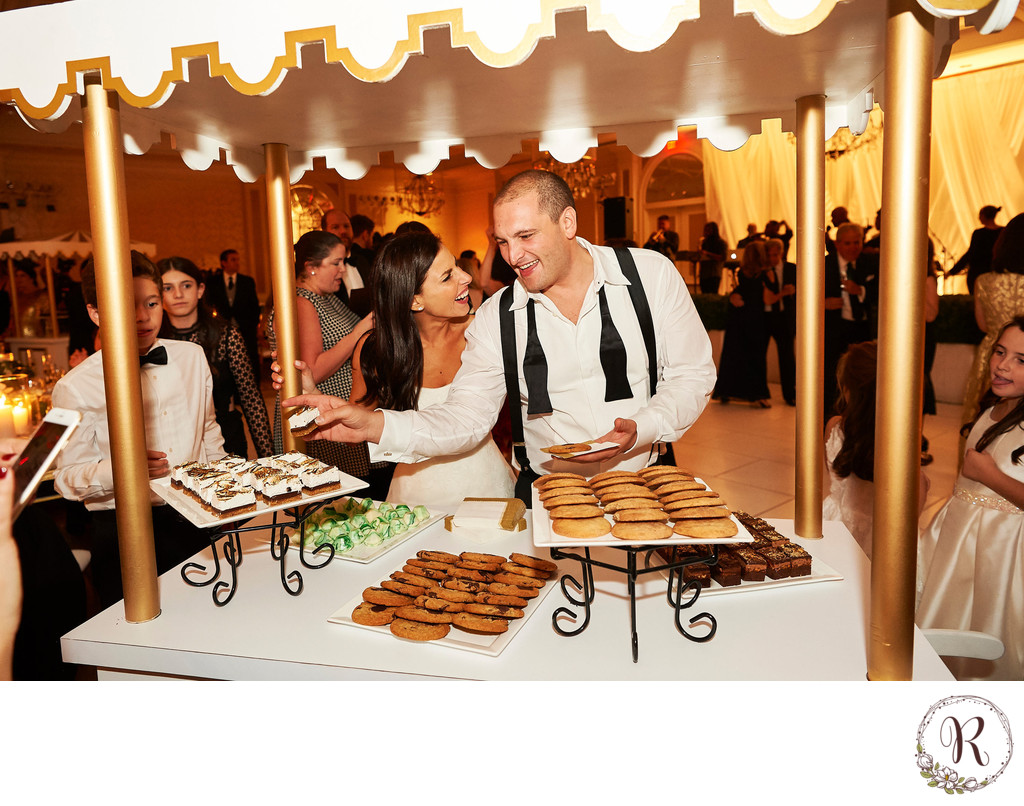 Bride & Groom Enjoying Dessert Stations