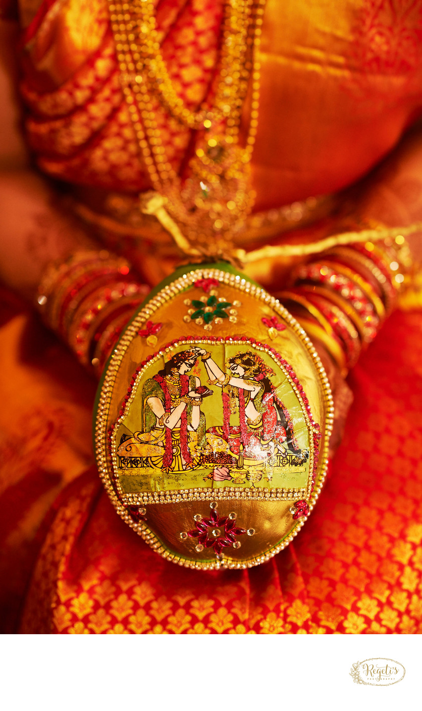 Telugu bride holding a decorated coconut
