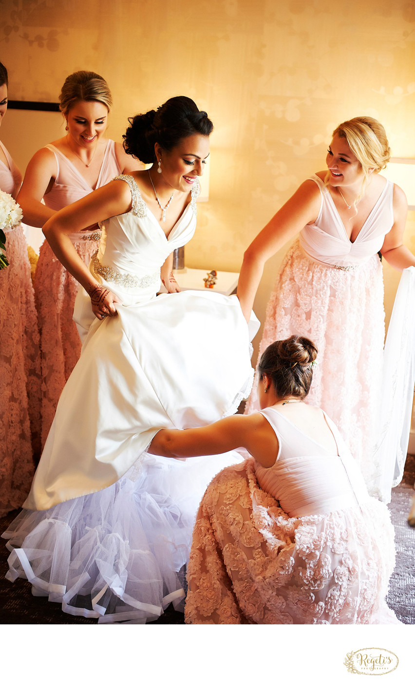 Bridesmaids Helping the Bride to Get Ready