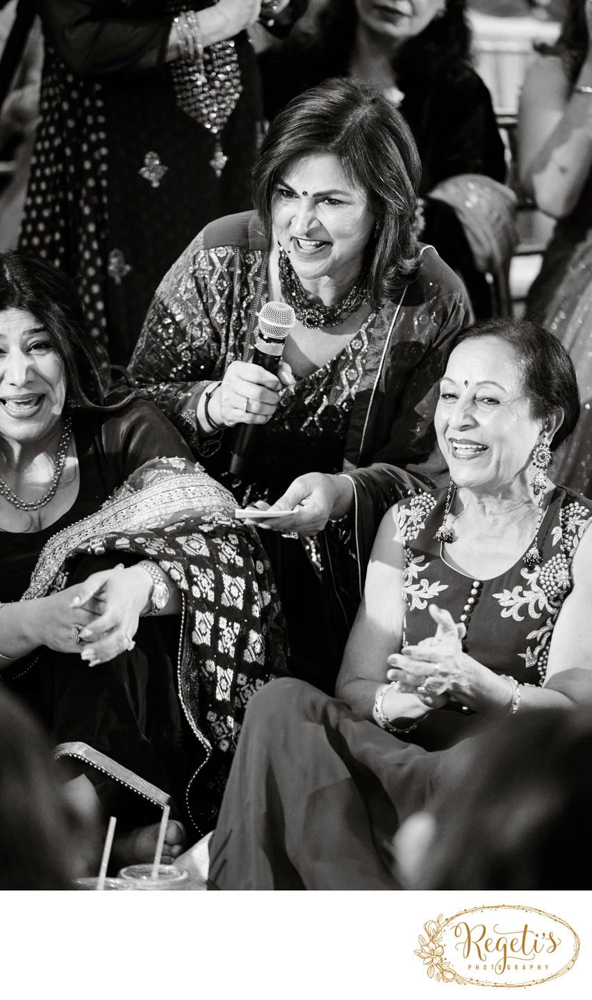 Aunties singing at an Indian Sangeet Ceremony