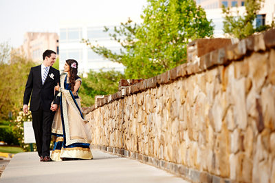 Bride and Groom Walking on the Bridge by Westin Dulles