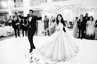 Bride and Groom dancing at their Indian wedding reception