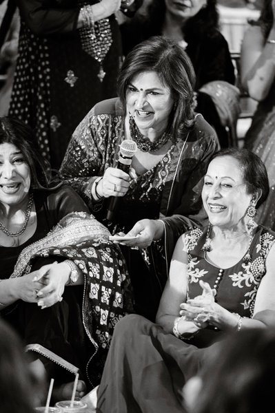 Aunties singing at an Indian Sangeet Ceremony