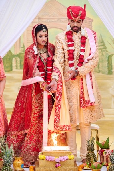 Bride and Groom Performing Hindu Rituals