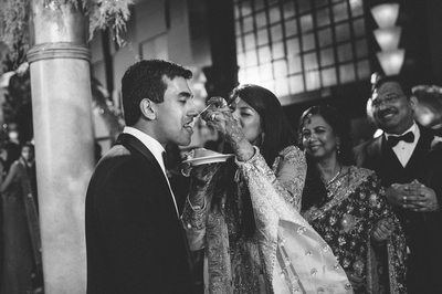 Feeding the Groom at South Asian Wedding at Cocomar