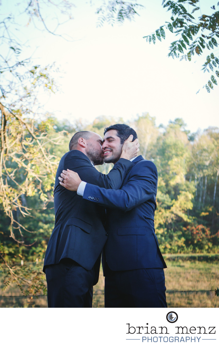 grooms embrace on wedding day gay lgbt 