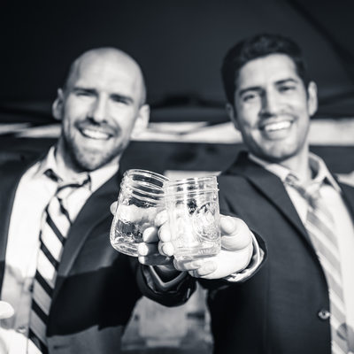 grooms toasting on wedding day gay LGBT wedding michigan