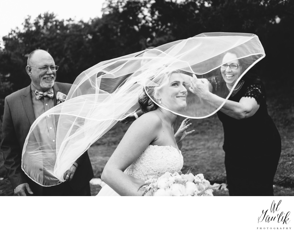 Texas wedding photographer wind-whipped bride smiles