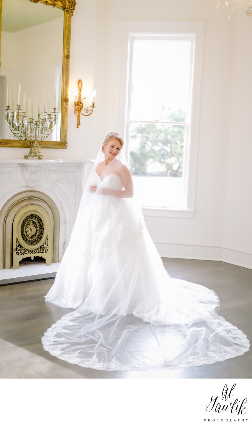 Bride posing by a fireplace