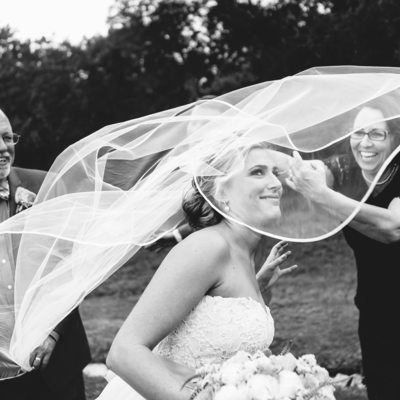 Texas wedding photographer wind-whipped bride smiles