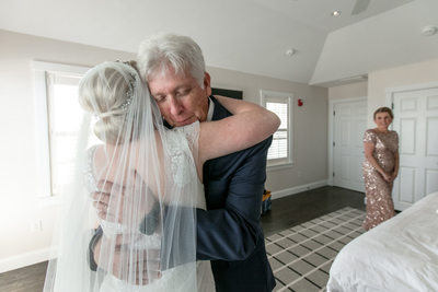Father and daughter hug before wedding