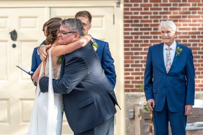 Bride Hugging Dad