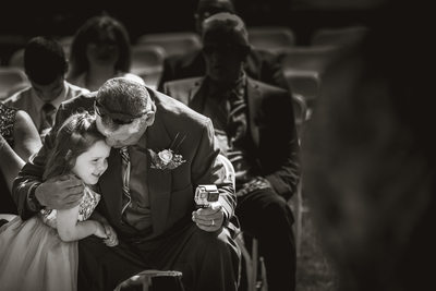 Flowergirl with grandfather candid moment