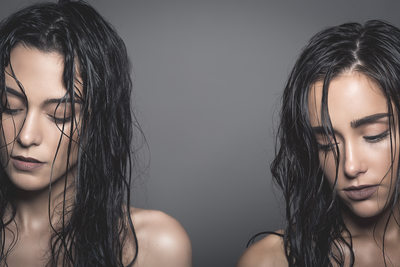 Two brunettes with wet hair