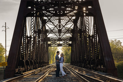 Engagement photo on railroad tracks