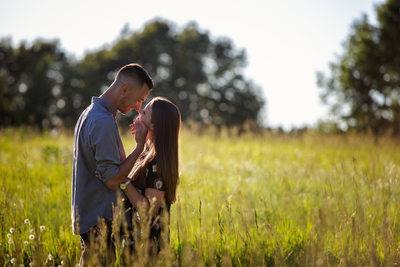 Engaged couple in field