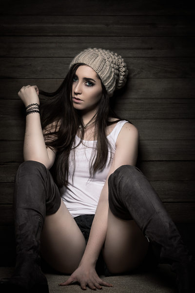 Brunette in a knit beanie and tank-top