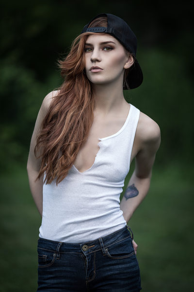 Model in Tank top and backwards hat