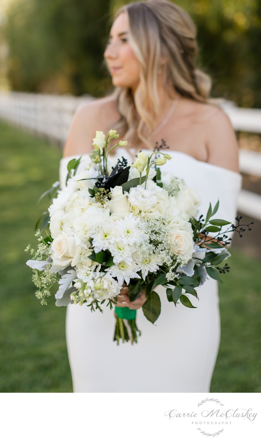 Bride with white bouquet at Rancho Guejito Vineyards.