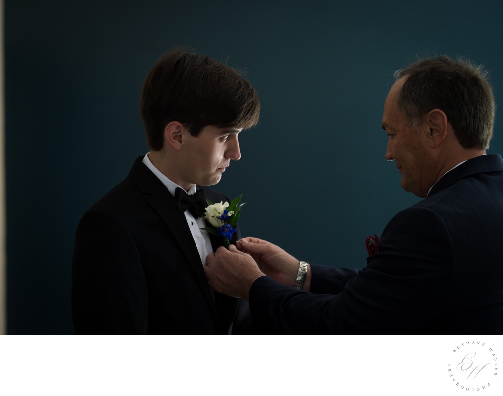 Groom with Boutonnière Being Pinned by His Father 