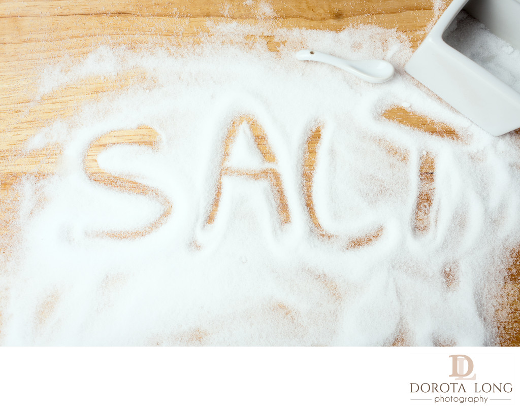 words SALT handwritten on salt