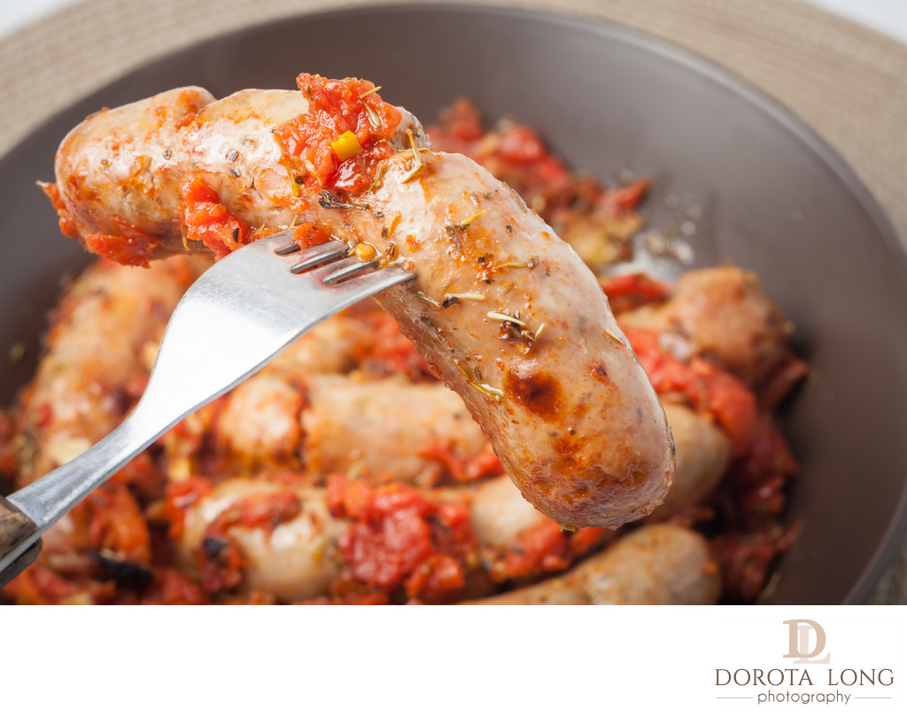 oven cooked sausages with tomatos, garlic and italian herbs