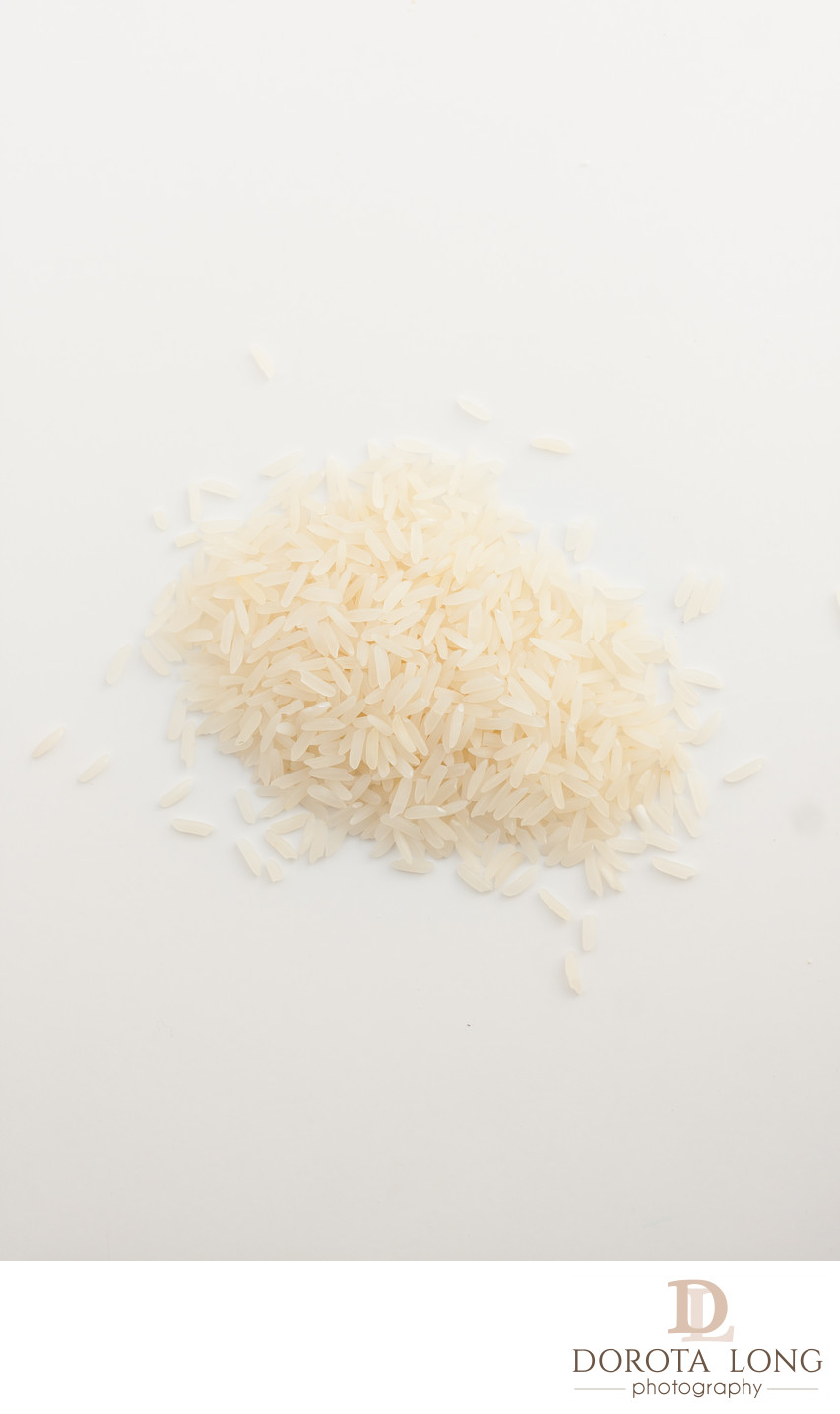 white rice spilled on white background