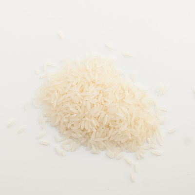 white rice spilled on white background