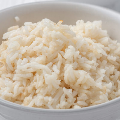 a bowl of rice cooked in chicken stock