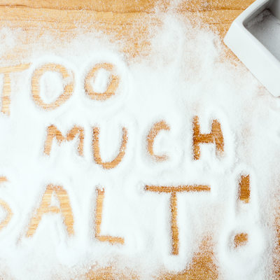 words TOO MUCH SALT handwritten on salt