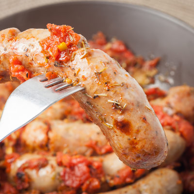 oven cooked sausages with tomatos, garlic and italian herbs