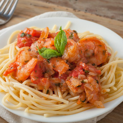 shrimp in wine tomato sauce over spaghetti pasta