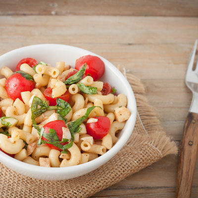 Italian macaroni salad with tomatoes and fresh basil