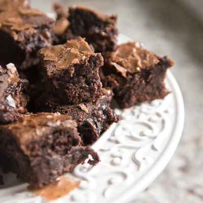 small pieces of brownies on white plate