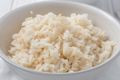 a bowl of rice cooked in chicken stock